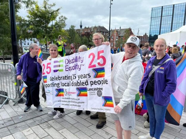 Picture of some members holding the DENW banner. Picture of some members holding the DENW banner.
