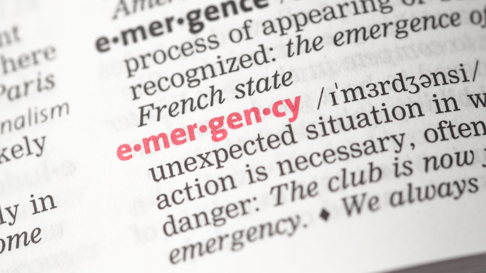 9360256_emergency-definition A dictionary open on the word "emergency", which is red.