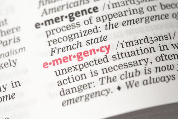 9360256_emergency-definition A dictionary open on the word "emergency", which is red.