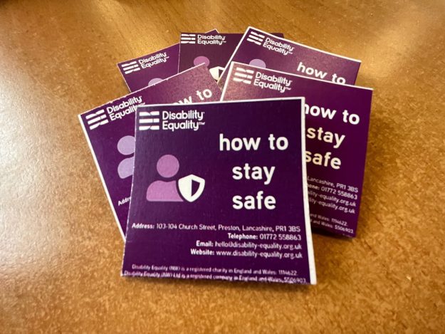 How to stay safe. A stack of the how to stay safe cards printed and folded back to back on a table