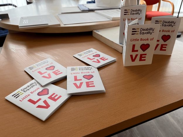 The Little Book of Love sat on a tabletop. The Little Book of Love sat on a tabletop.