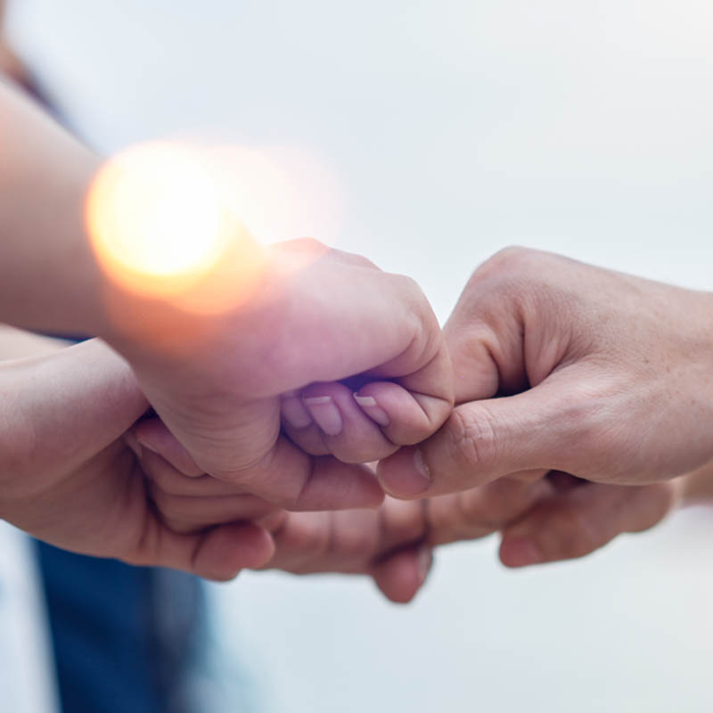 Volunteers connecting hands Volunteers connecting hands