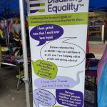 Photo of DENW pull-up banner including some of the quotes from members - stood at the front of the stall.