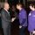 Mel Close shaking hands with the King, Mel is wearing the DENW purple branded tshirt alongside Kathy Lester – Denw Chairperson.